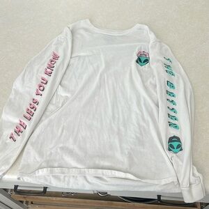 Cool, alien long sleeve T-shirt. “The less you know the better”